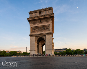 Eiffel Tower and the Arc de Triomphe under a Half Moon